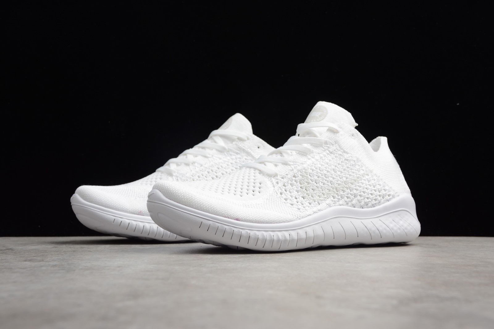 white flyknit shoes
