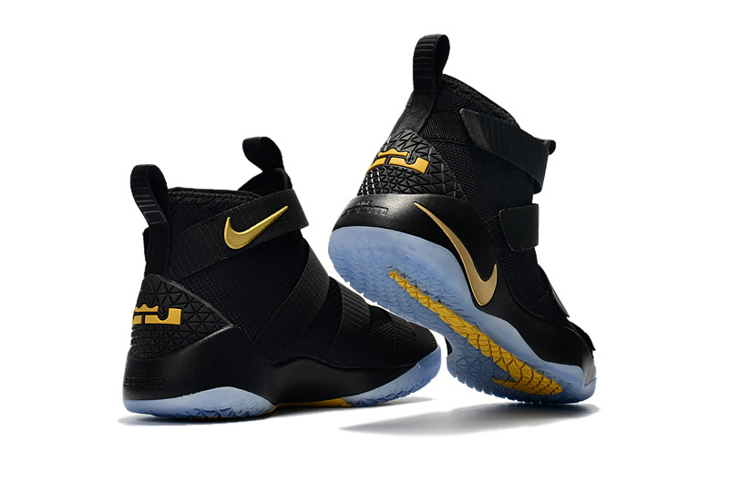 Lebron Soldiers XI 11 covering up the shoe s traditional Air Max unit and making it non visible GaleriahitShops Nike Zoom Lebron Soldiers XI 11 black gold Youth Big Kid Shoes